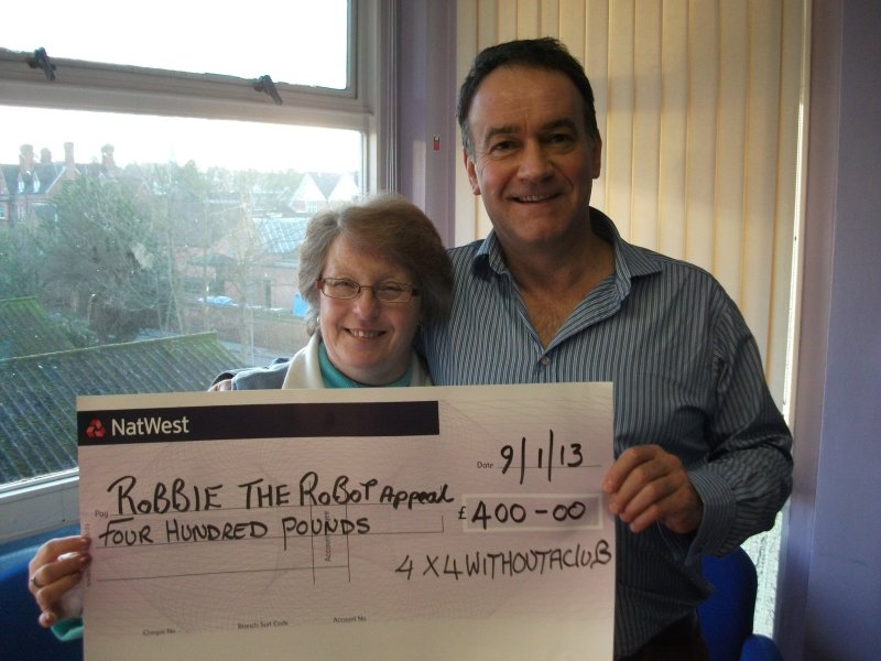 Steph Awbery presenting a cheque to Mark Goff